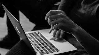 Close up of person using a laptop