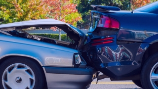 Two cars involved in a collision rear end