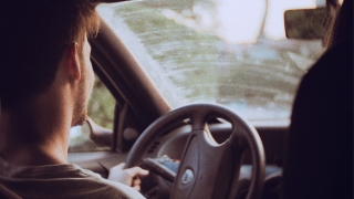 Young man driving a car